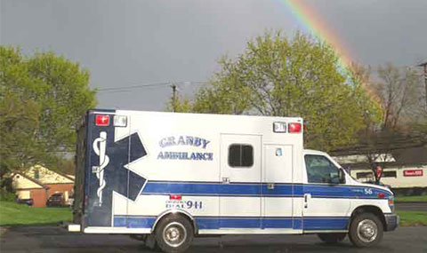 Granby Ambulance beneath a rainbow